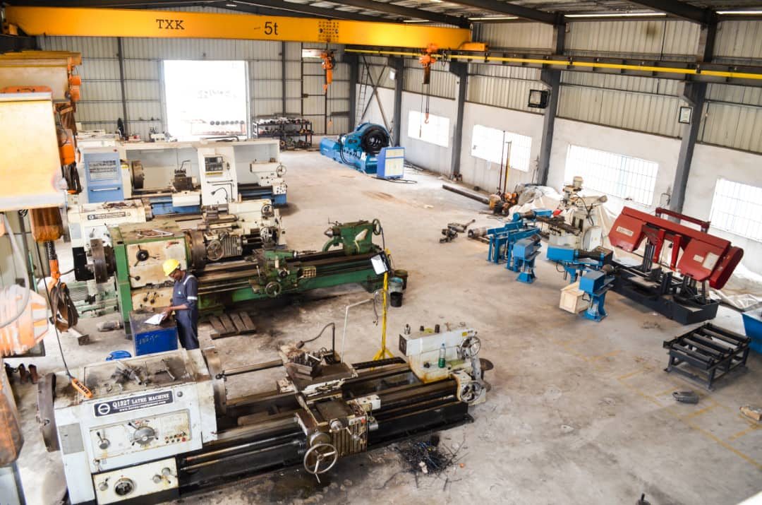 The Reveille machine shop floor in Port Harcourt, with lathes, milling machines and overhead crane runs